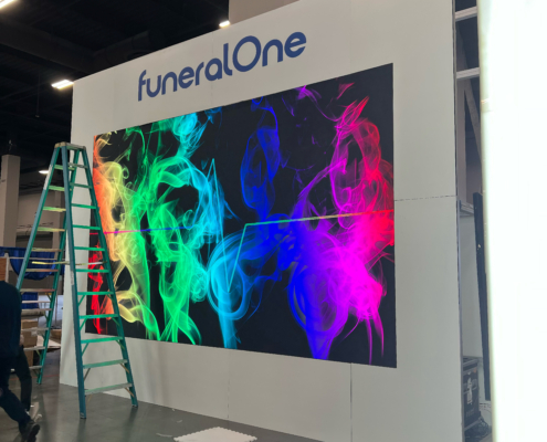 Large LED video wall setup at trade show booth by AVR Expos for brand presentation